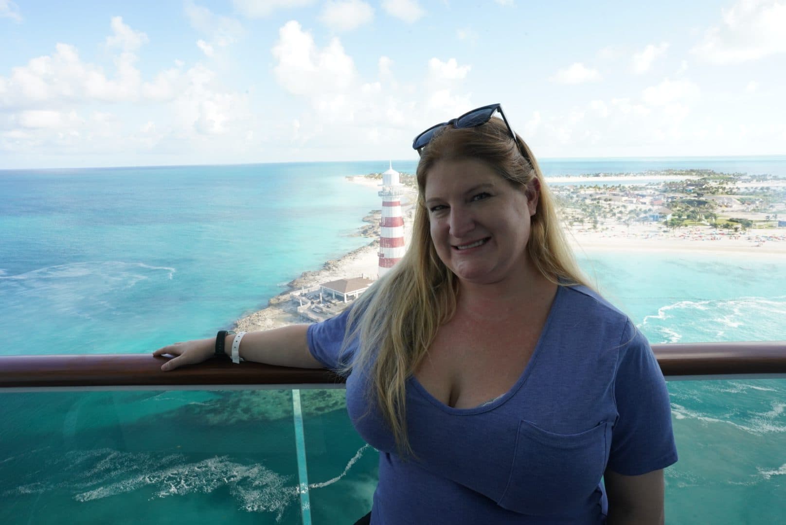 Kathryn Lyn at the rail of a cruise ship with the sea behind her