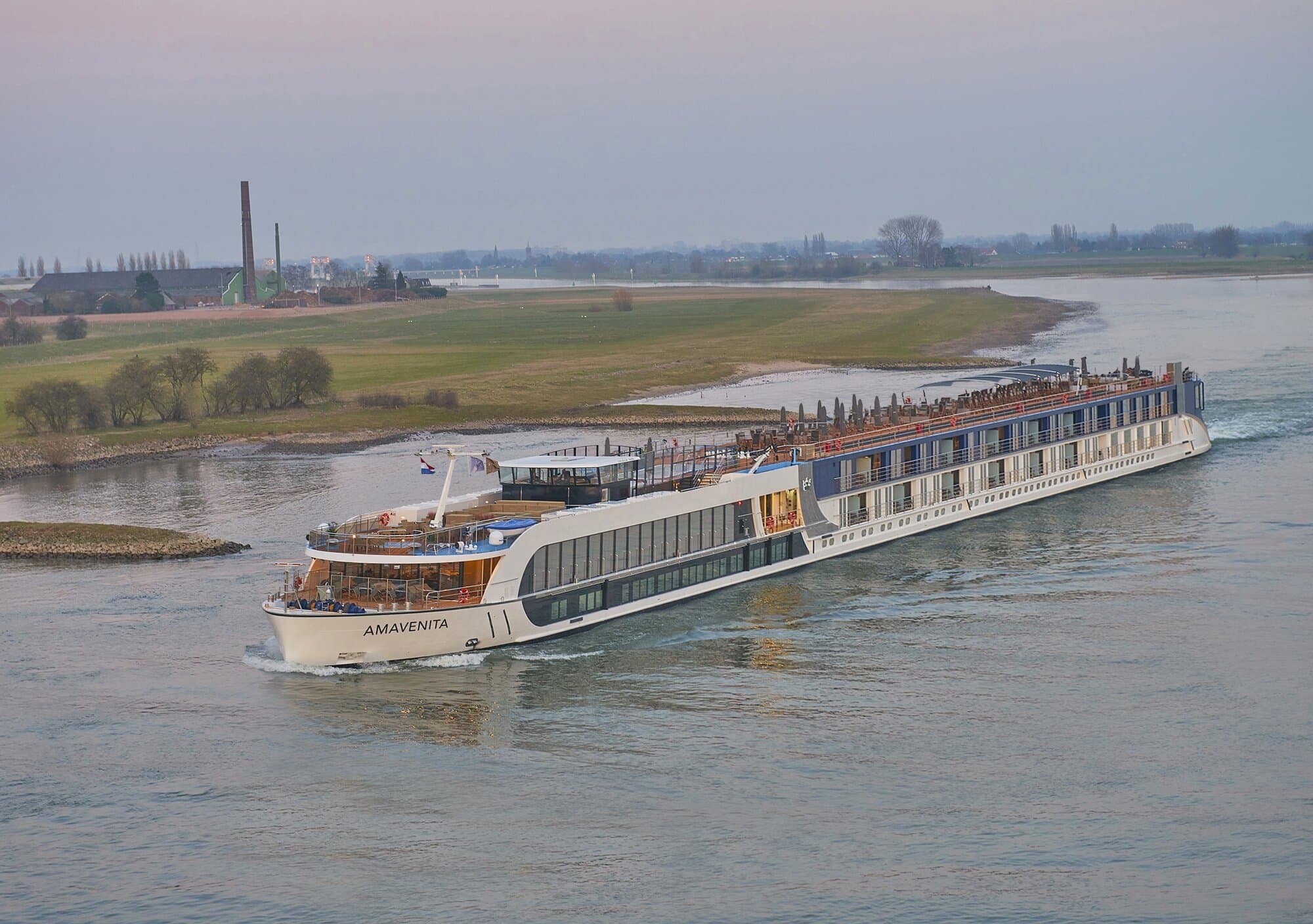 AmaVenita cruising the Rhine River through the countryside at sunset in Germany
