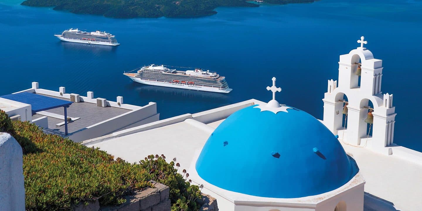 Santorini view with blue dome and sea